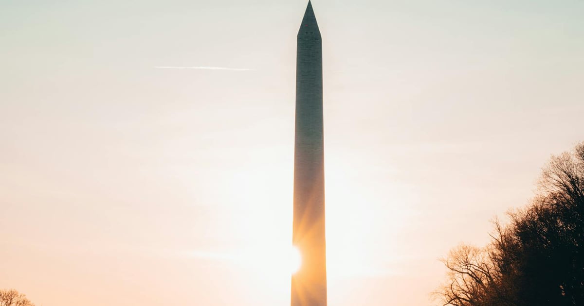 Washington Monument and Reflecting Pool at sunrise in Washington DC