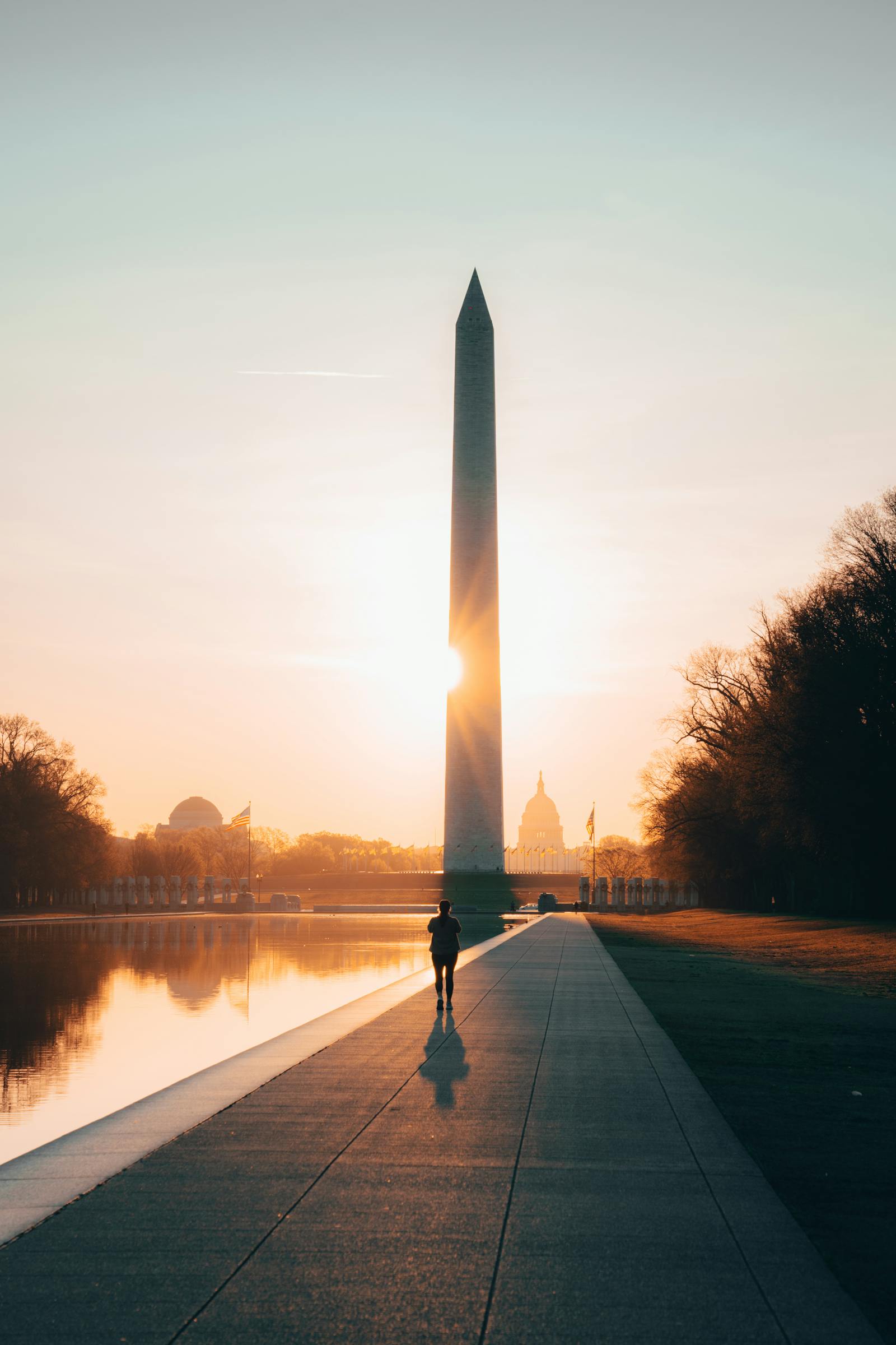 Washington Monument and Reflecting Pool at sunrise in Washington DC